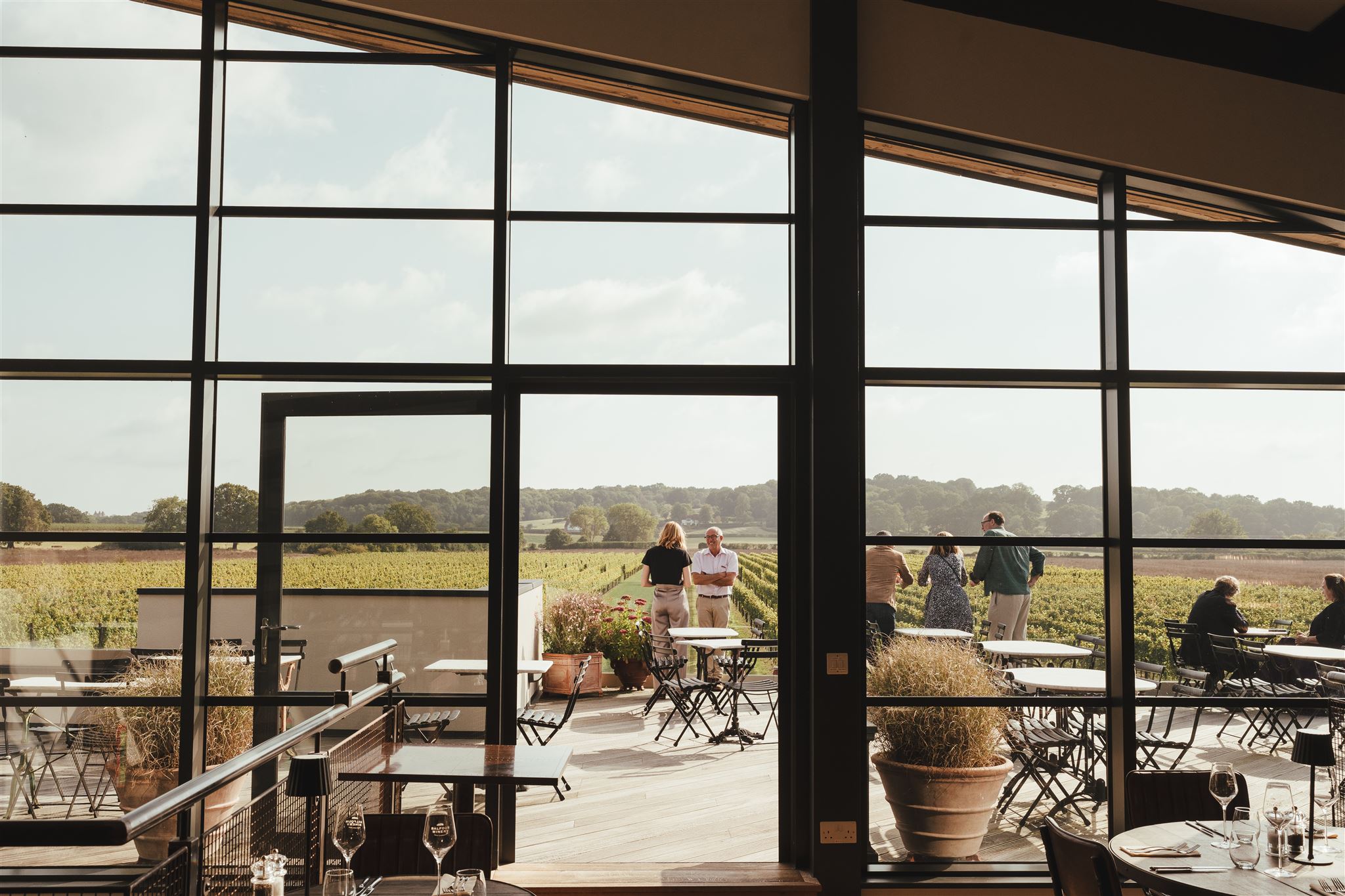 Happy people drinking English wine at Balfour Winery